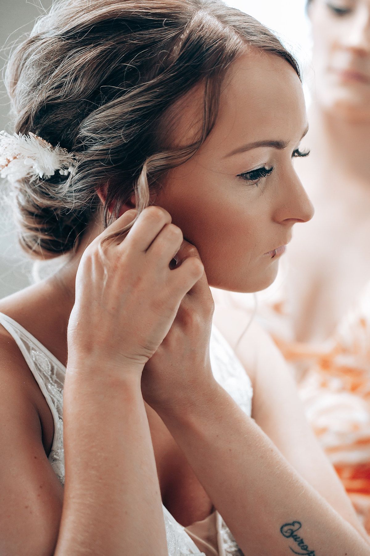 A series of photos showing someone getting their hair and makeup done during wedding preparations.