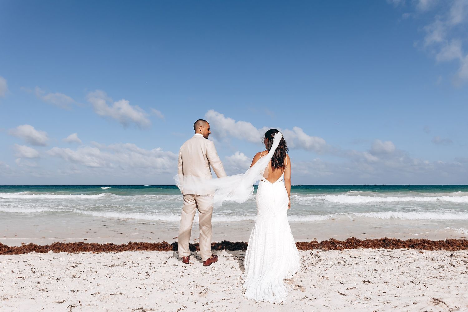 Wedding couple walking on the beach at NEST Tulum Tulum