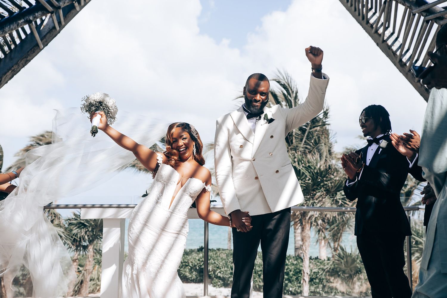 Wedding celebration moments captured under an architectural canopy with geometric shadows and natural light.