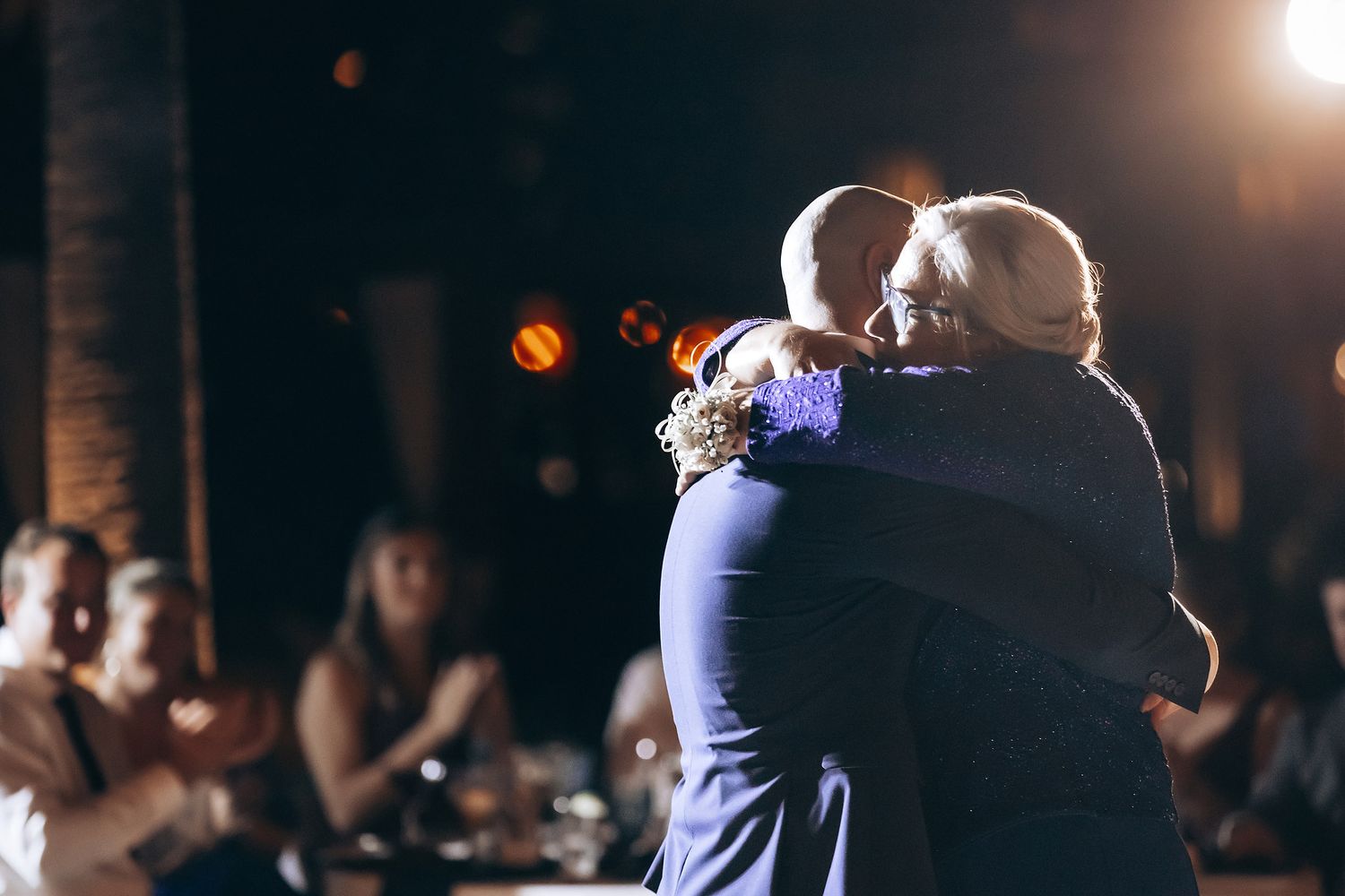 A bride and groom sharing a dance at their wedding reception.