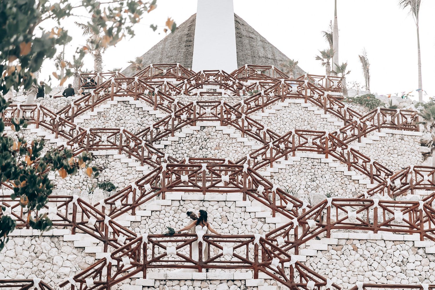 Ornate stone bridge architecture with decorative patterns and arches in sepia tones.