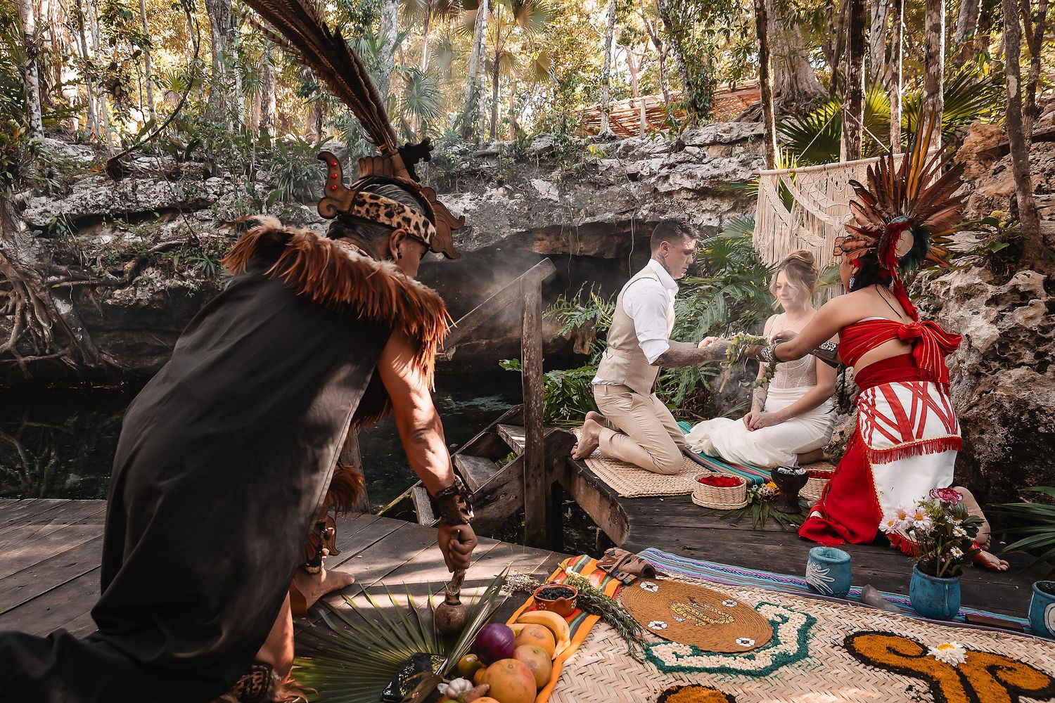 Mayan ceremony wedding ritual in jungle cenote with traditional attire and ceremonial offerings.