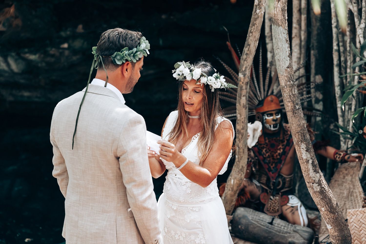 Wedding ceremony in a lush forest setting with traditional spiritual elements.