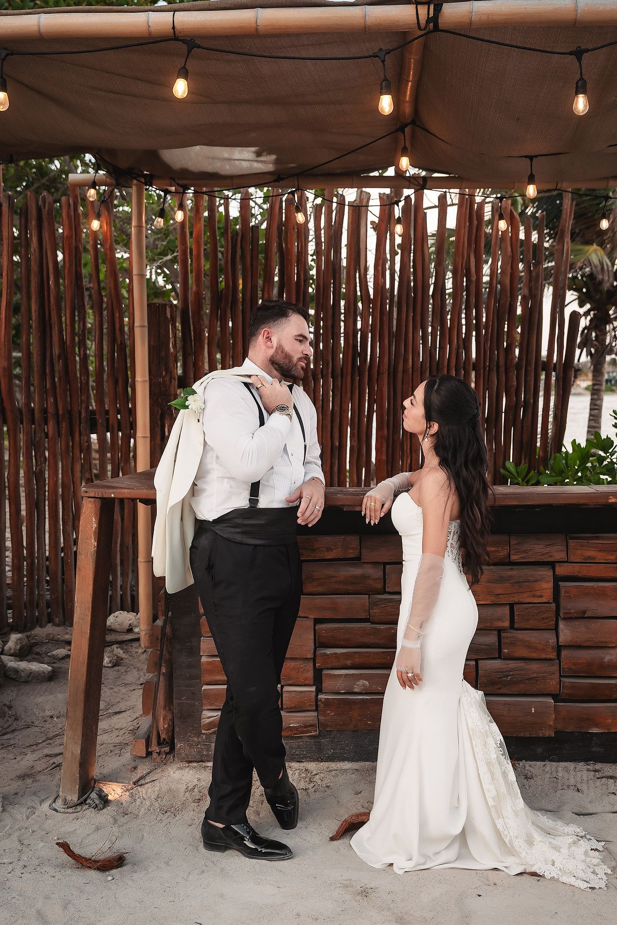 A romantic wedding photoshoot sequence showing tender moments between newlyweds against a rustic wooden backdrop.