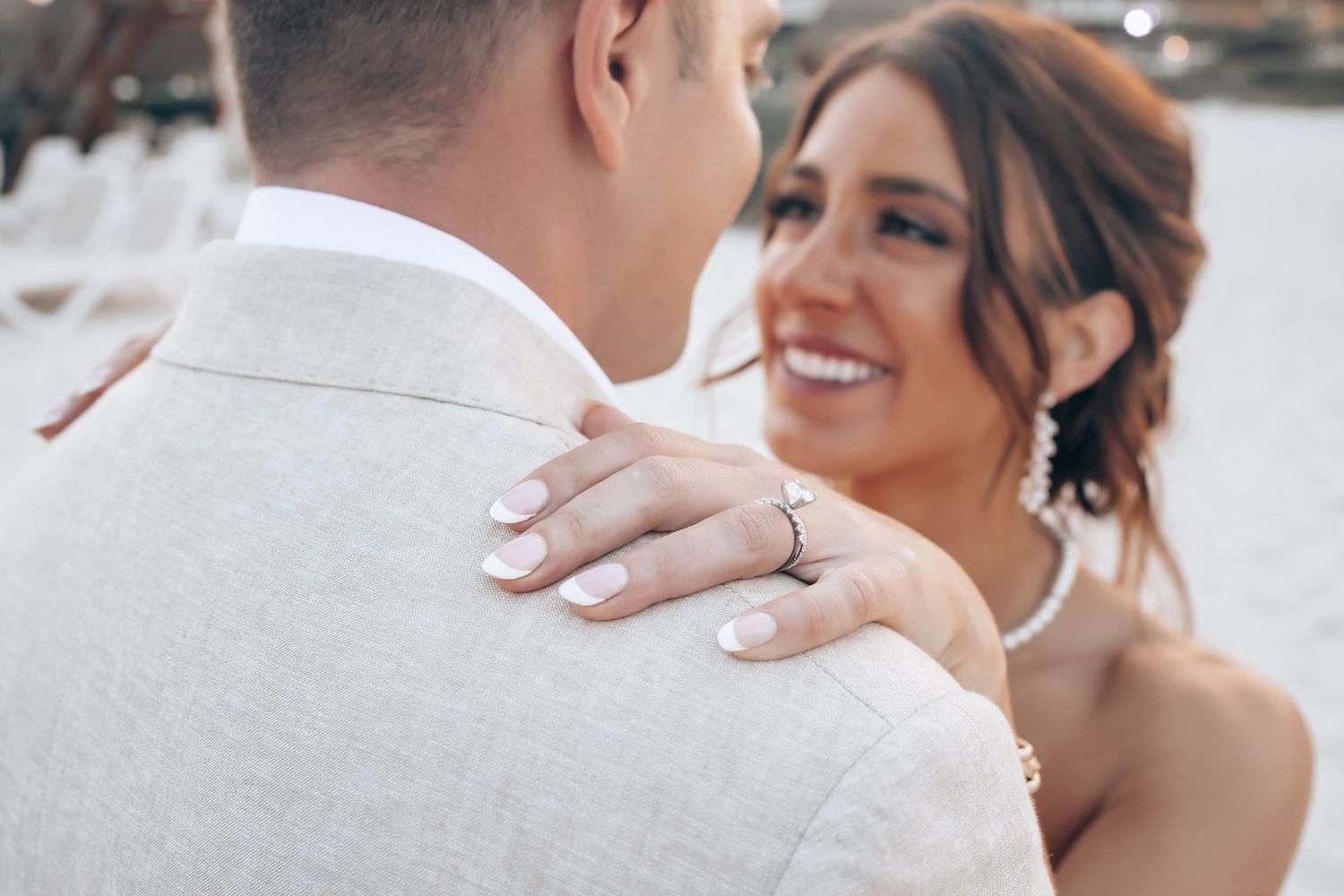 Candid wedding photography showing joyful laughter and embraces.