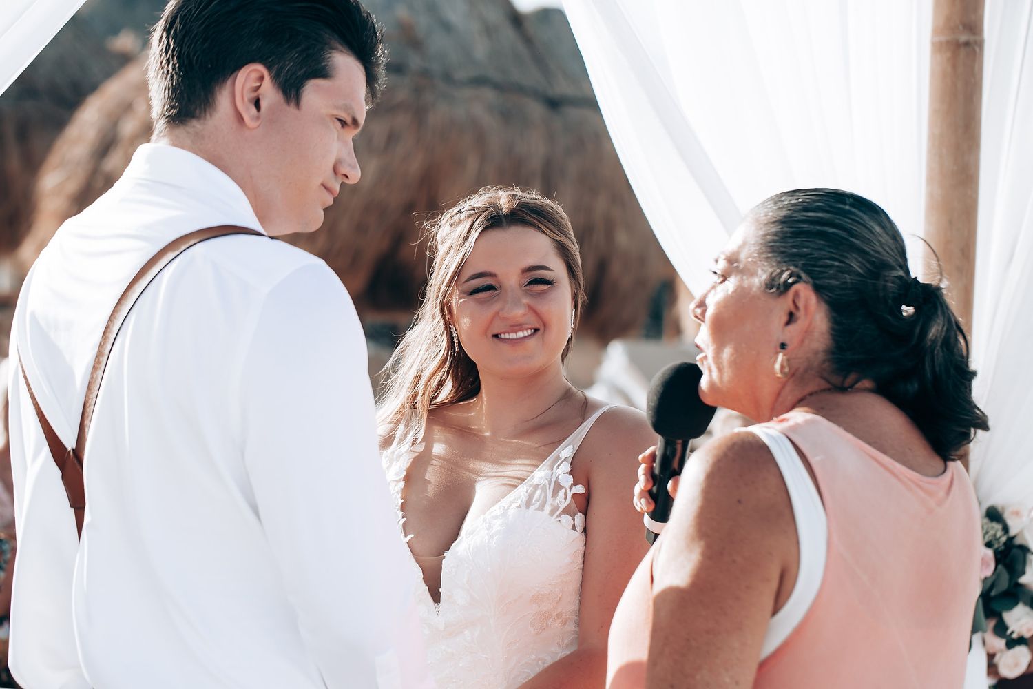 Candid moments of joy and laughter captured during an elegant outdoor wedding celebration.