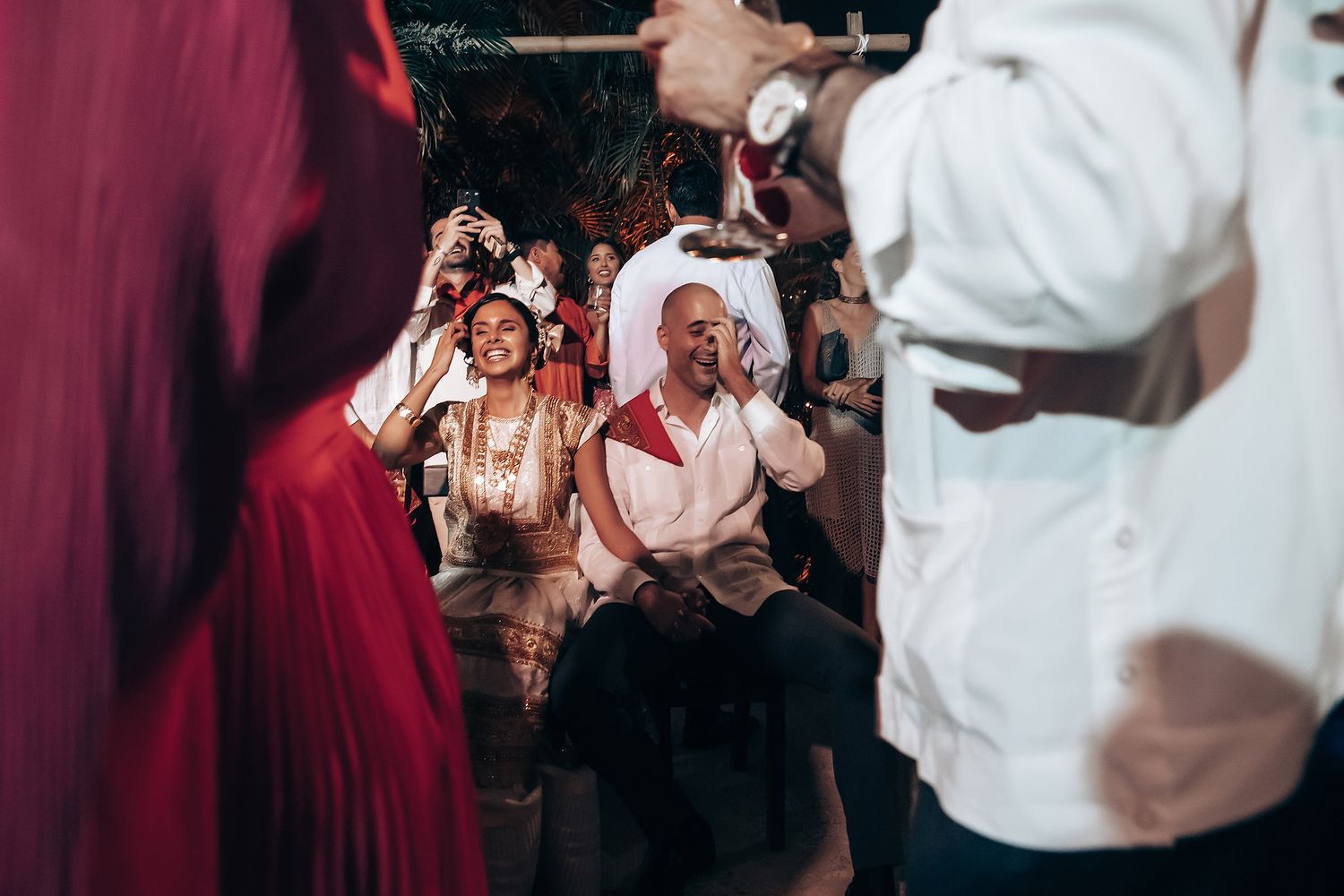 Musicians in white shirts performing at an elegant evening celebration.