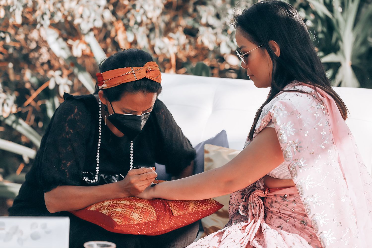 Close-up shots of hands exchanging rings during a traditional wedding ceremony.