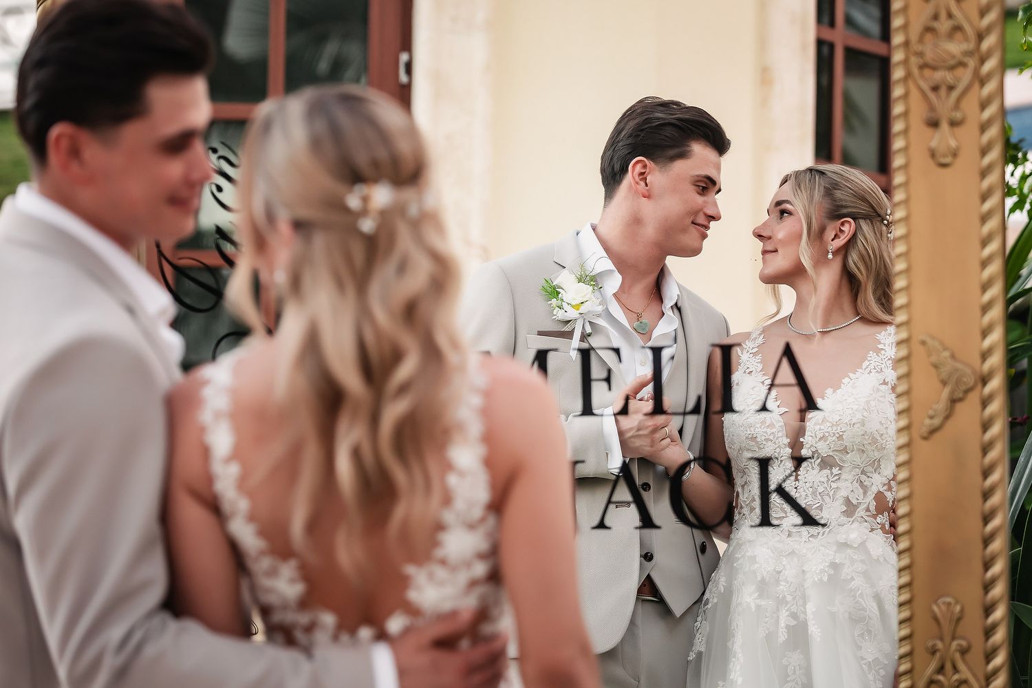 Romantic wedding portraits in an elegant venue with ornate decor.