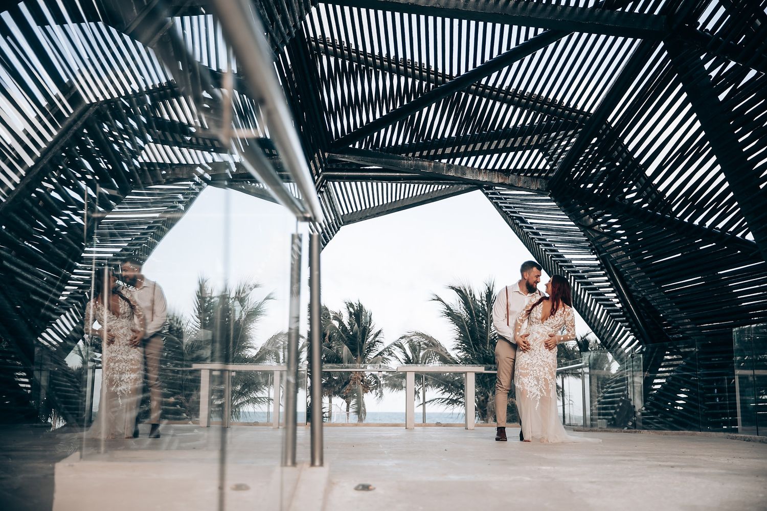 Modern architectural pergola structure with slatted roof casting dramatic shadows.