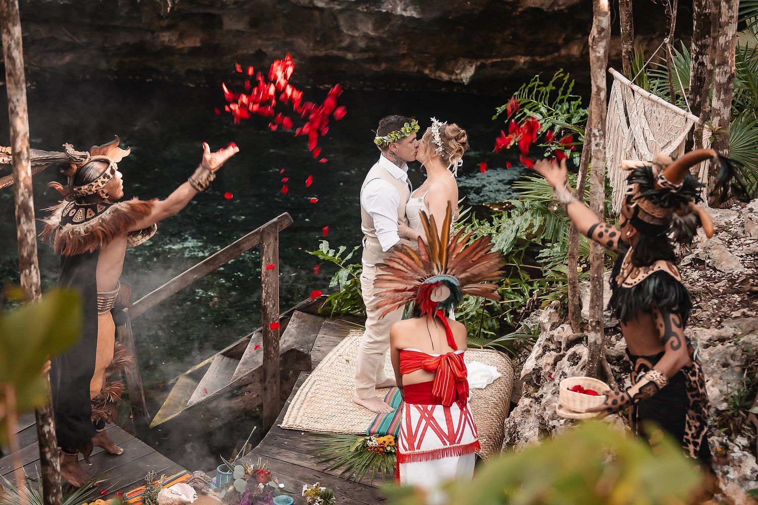 A celebratory moment captured in an outdoor setting with red decorative elements.