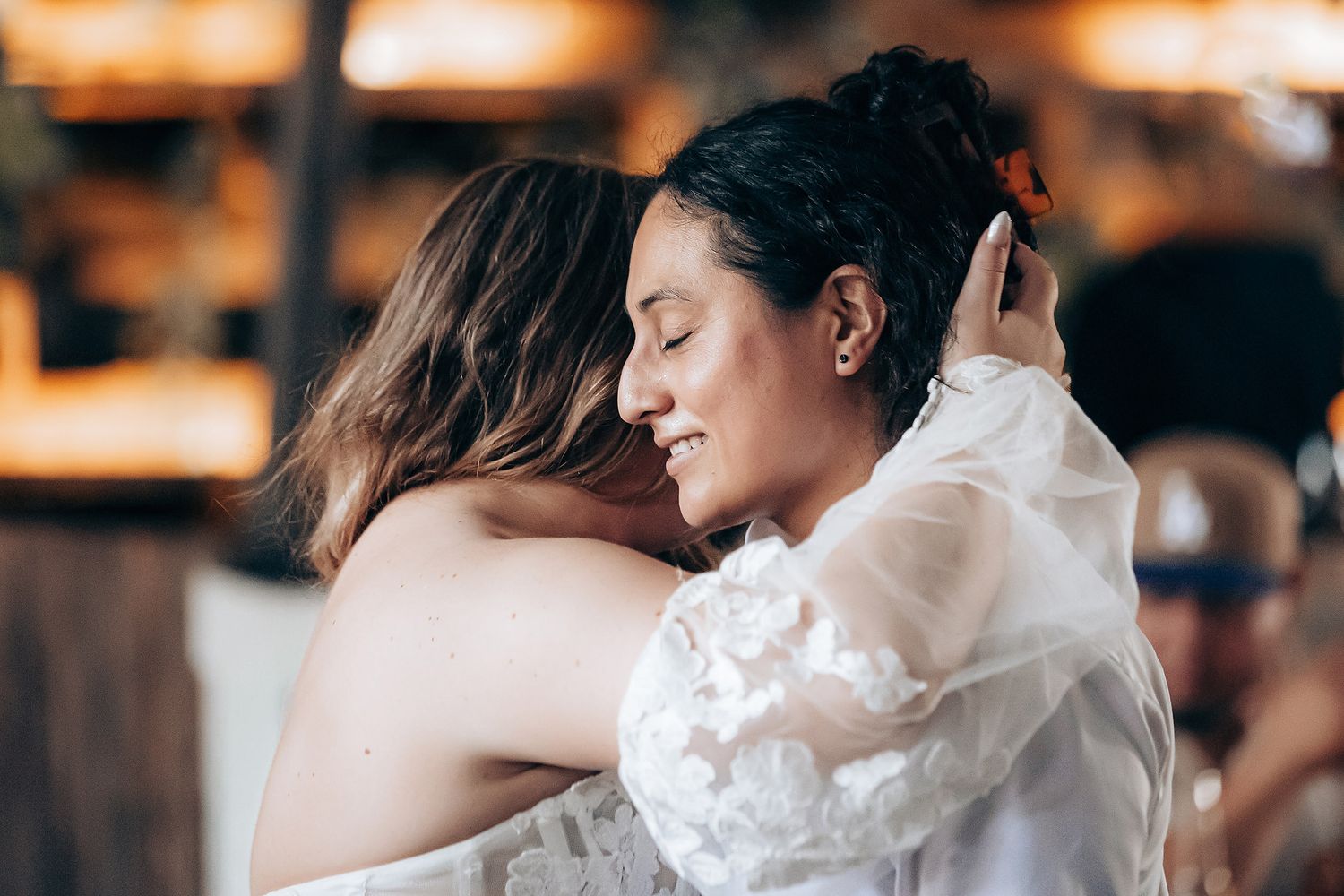 A series of romantic wedding photos showing intimate moments between a couple in a warm, candlelit setting.