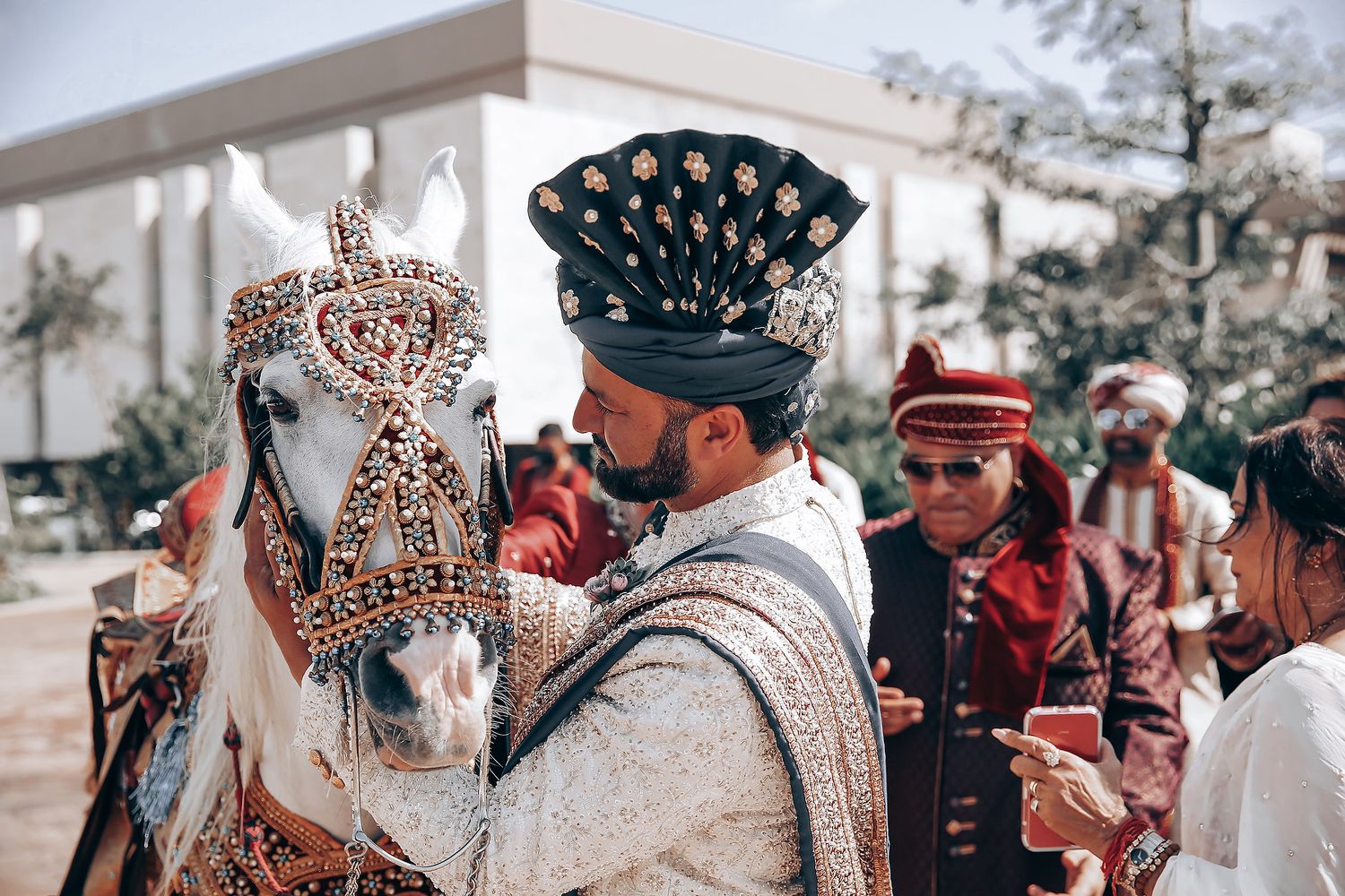 Traditional wedding celebration with guests in colorful cultural attire.