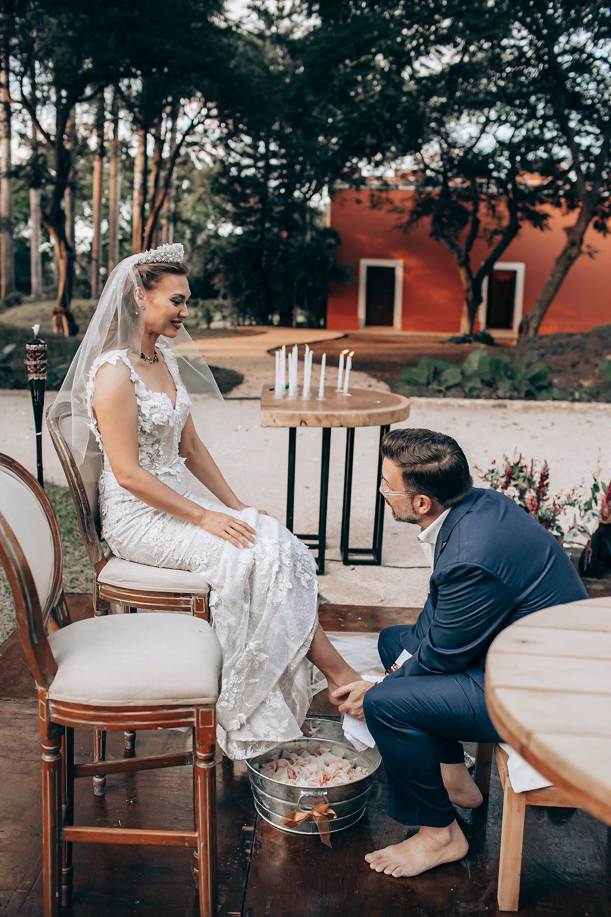 Sequence showing a person in a white lace dress sitting on wooden chairs during an outdoor photo session.
