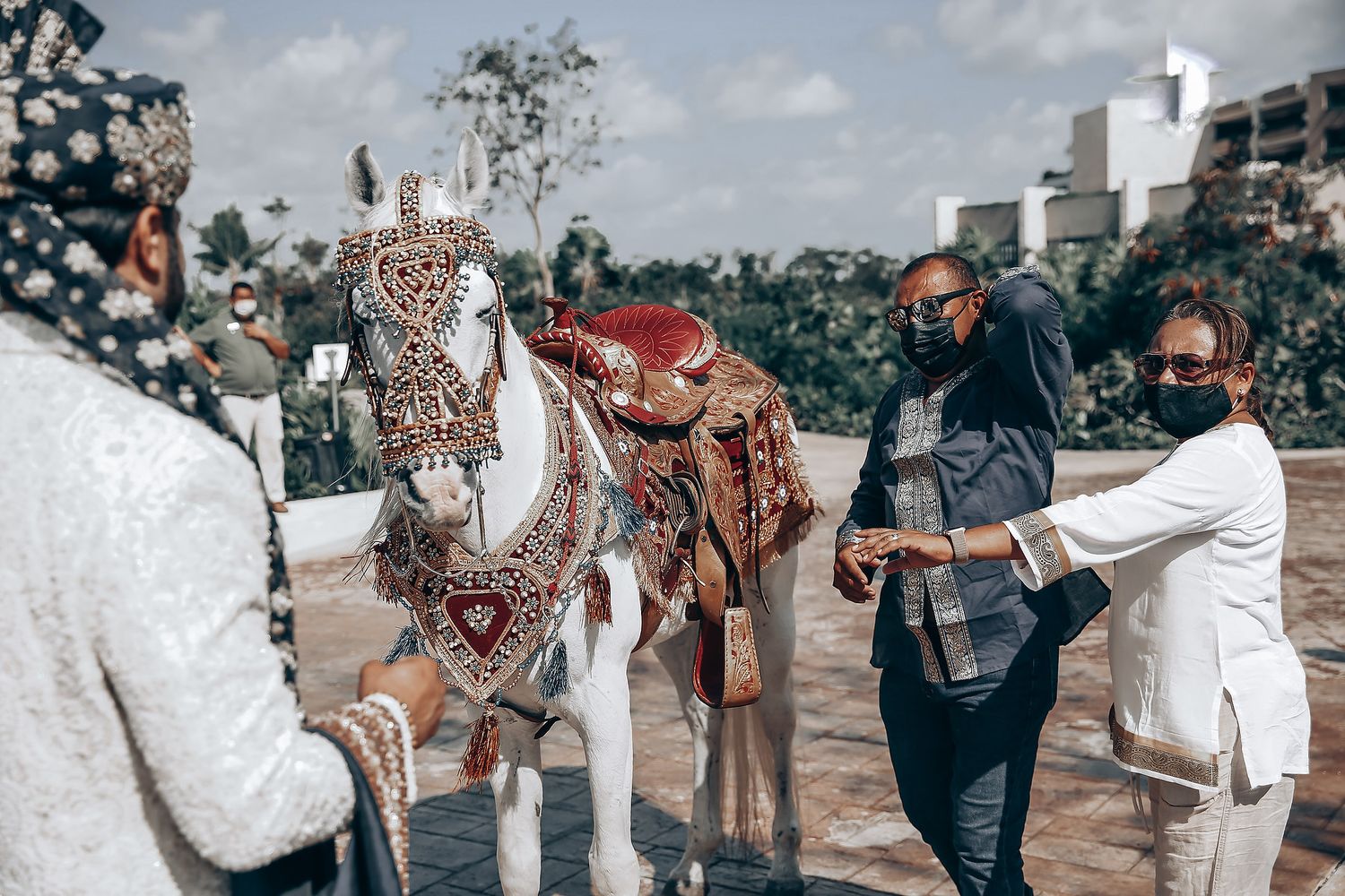 Festive outdoor celebration with guests in traditional and modern attire.