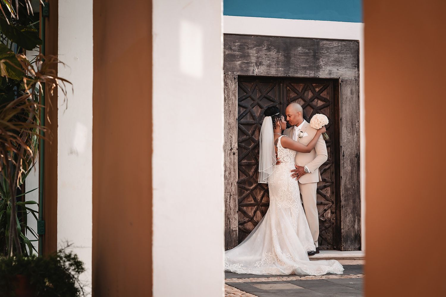 Wedding photo sequence against terracotta walls and columns in elegant venue setting.