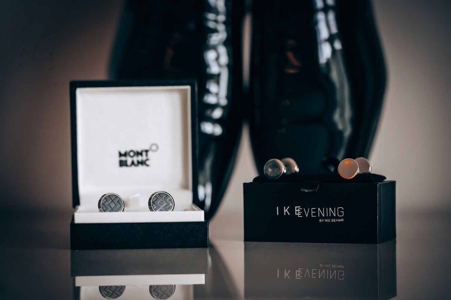 Luxury Mont Blanc cufflinks and accessories displayed in black boxes with elegant branding and packaging details.