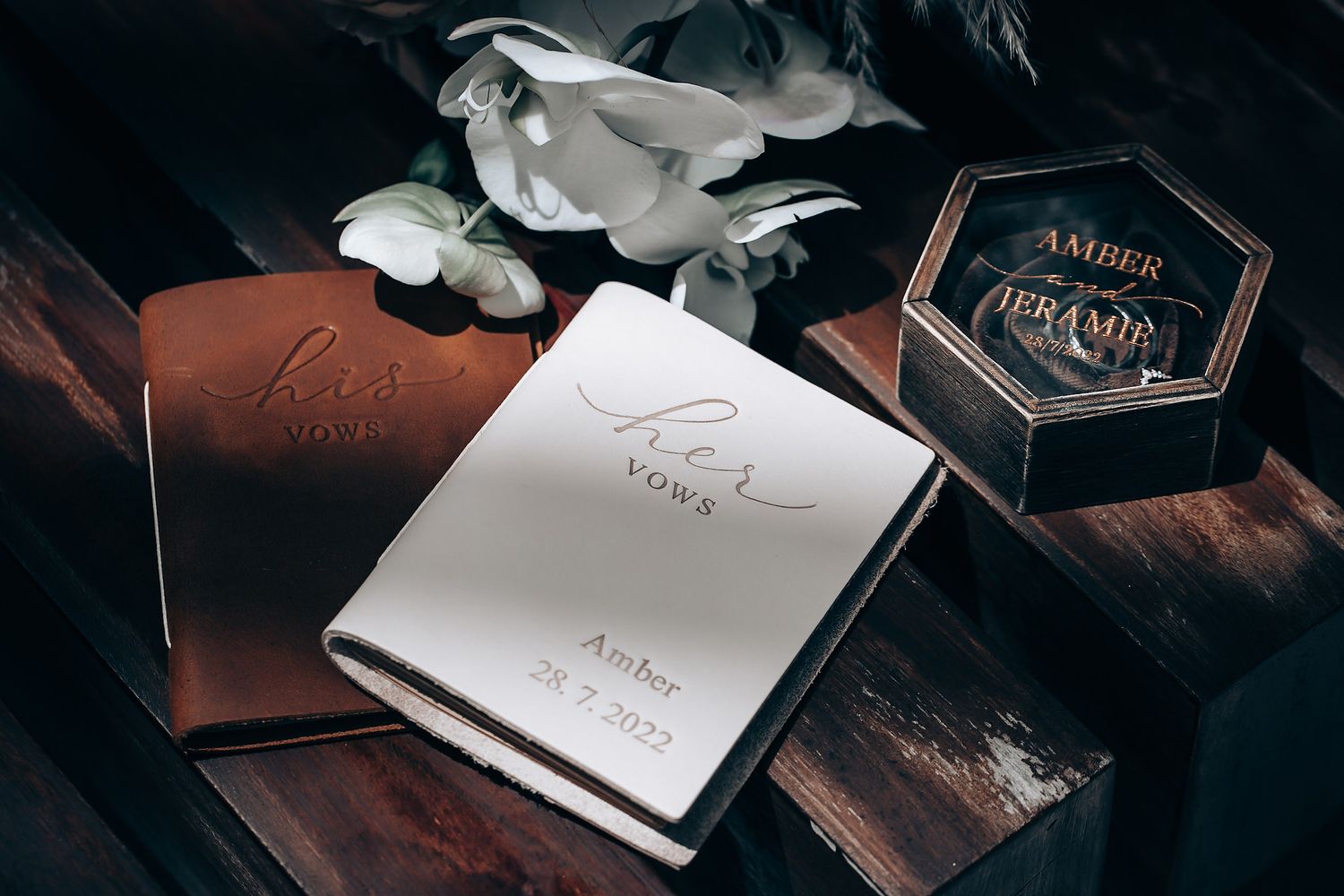A series of dark and moody photographs showing books and papers arranged in a vintage aesthetic style.