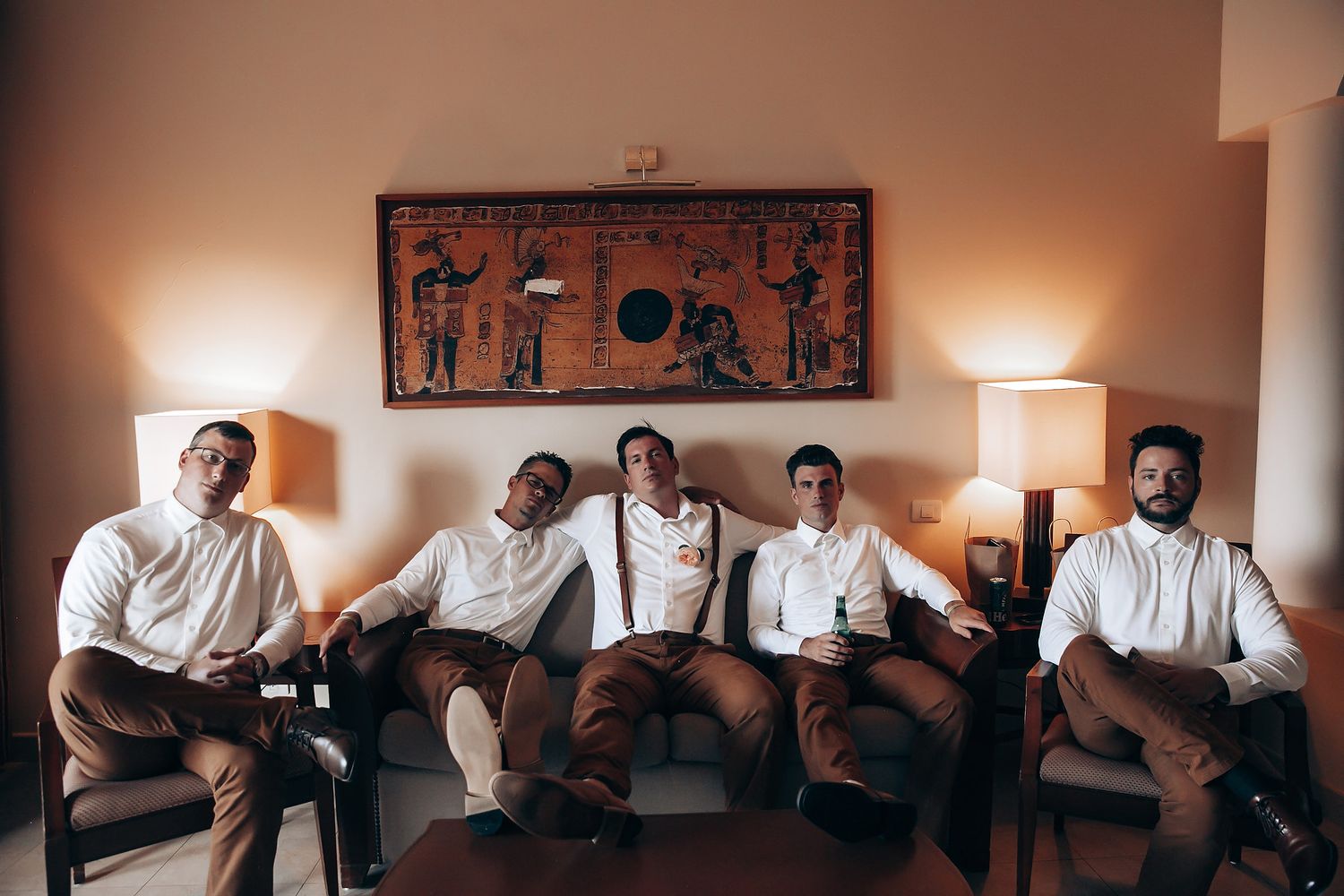 Wedding party members perform synchronized dance moves in formal attire.