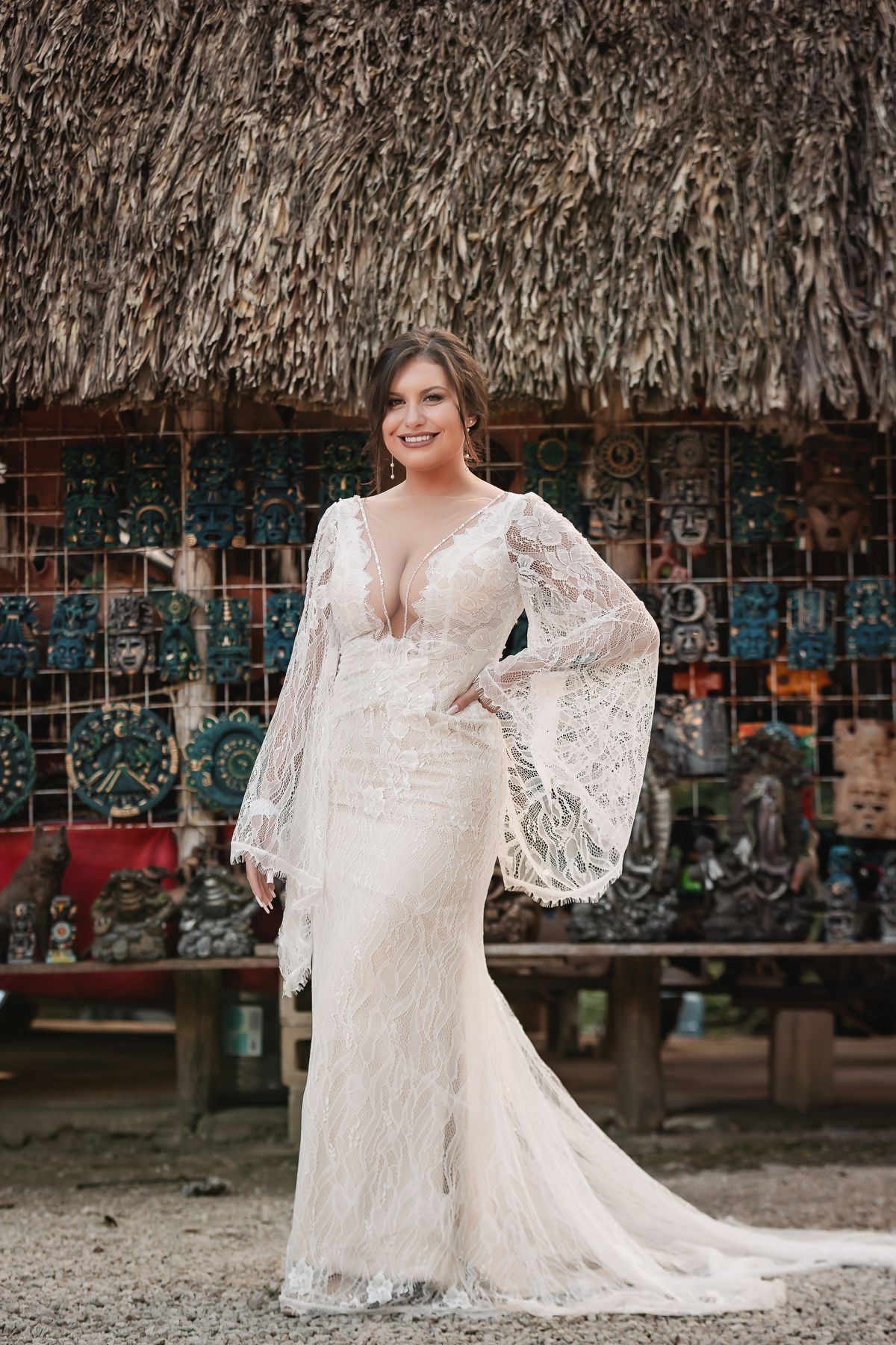 A sequence of photos showing a bride in a flowing lace wedding dress posing against a rustic thatched roof backdrop.