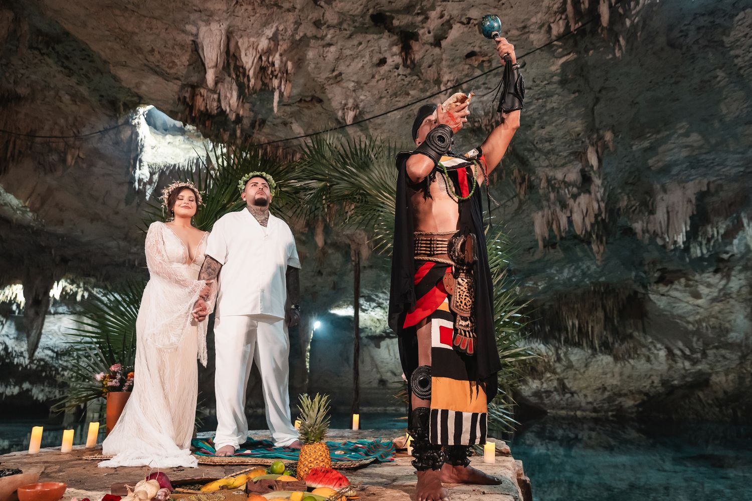 Ancient Mayan wedding ritual performed in a dramatic cave setting with traditional ceremonial dress.