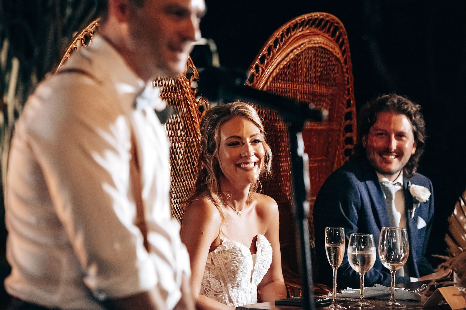 Intimate wedding reception dinner with ambient lighting and decorative details.