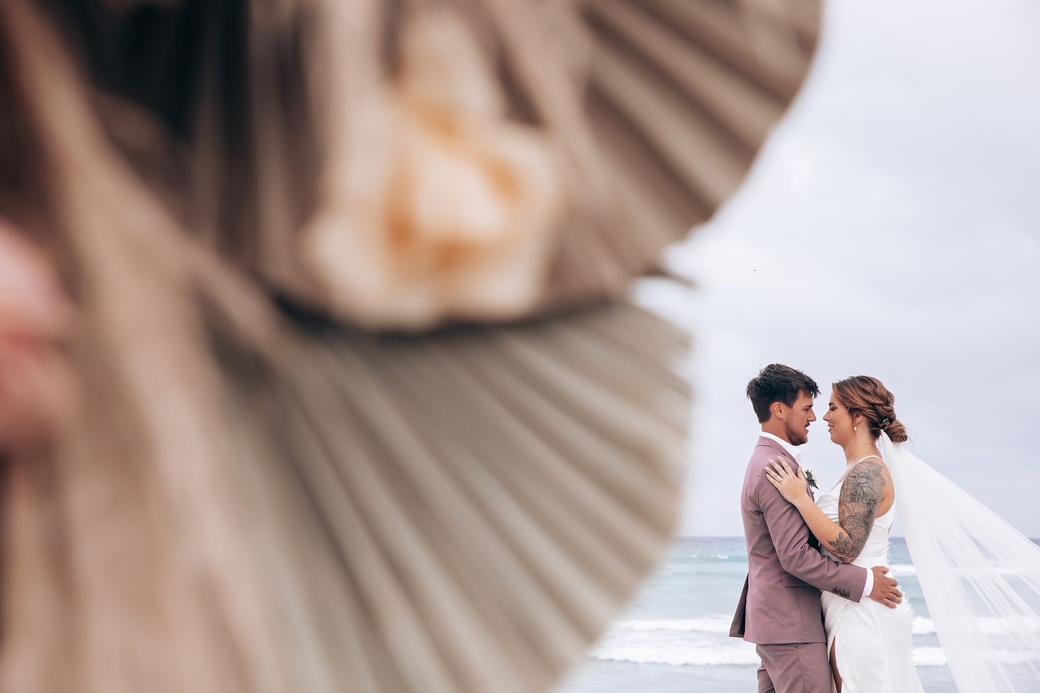 Elegant fan-shaped wedding ceremony program in neutral tones.