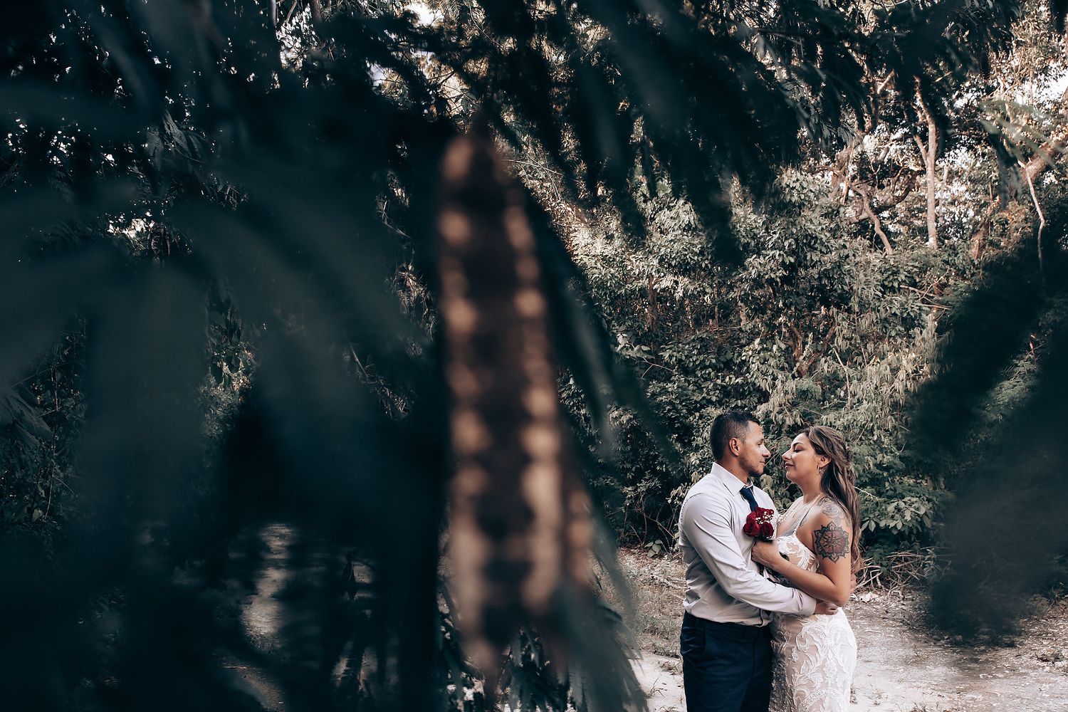 Dramatic shadows and natural light create a magical atmosphere in this cave wedding setting.