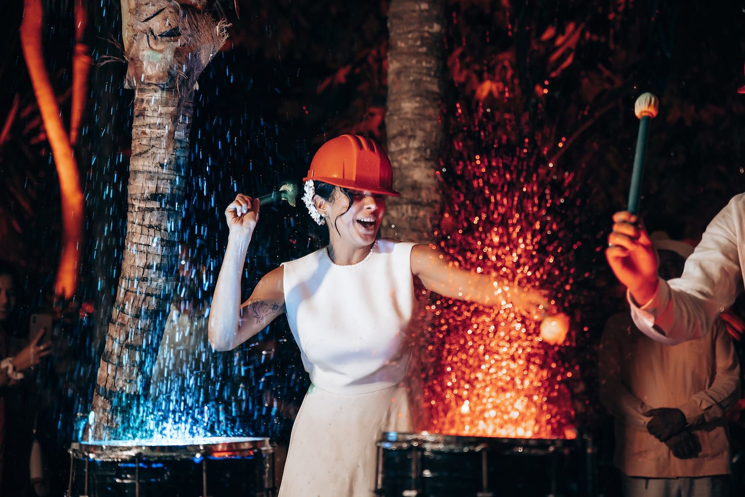 Red and blue light effects illuminate a dark nightclub space with sparkling effects.
