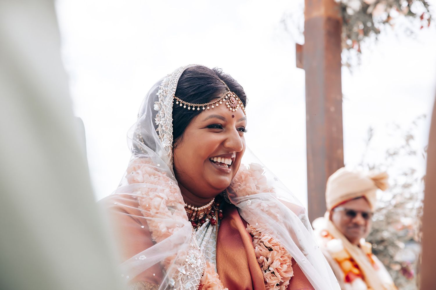 A joyful moment captured during a traditional South Asian wedding ceremony.