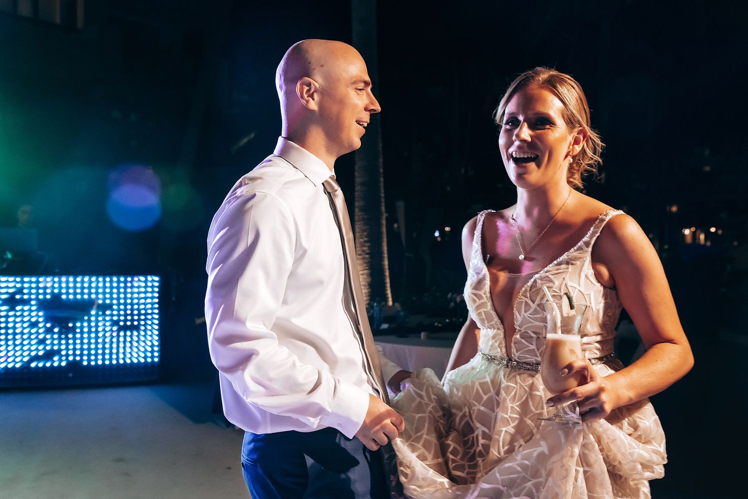 A man and woman dancing together at a formal event.