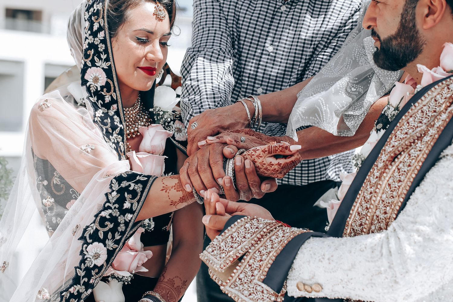 Couple sharing an intimate moment during their wedding ceremony with guests looking on.