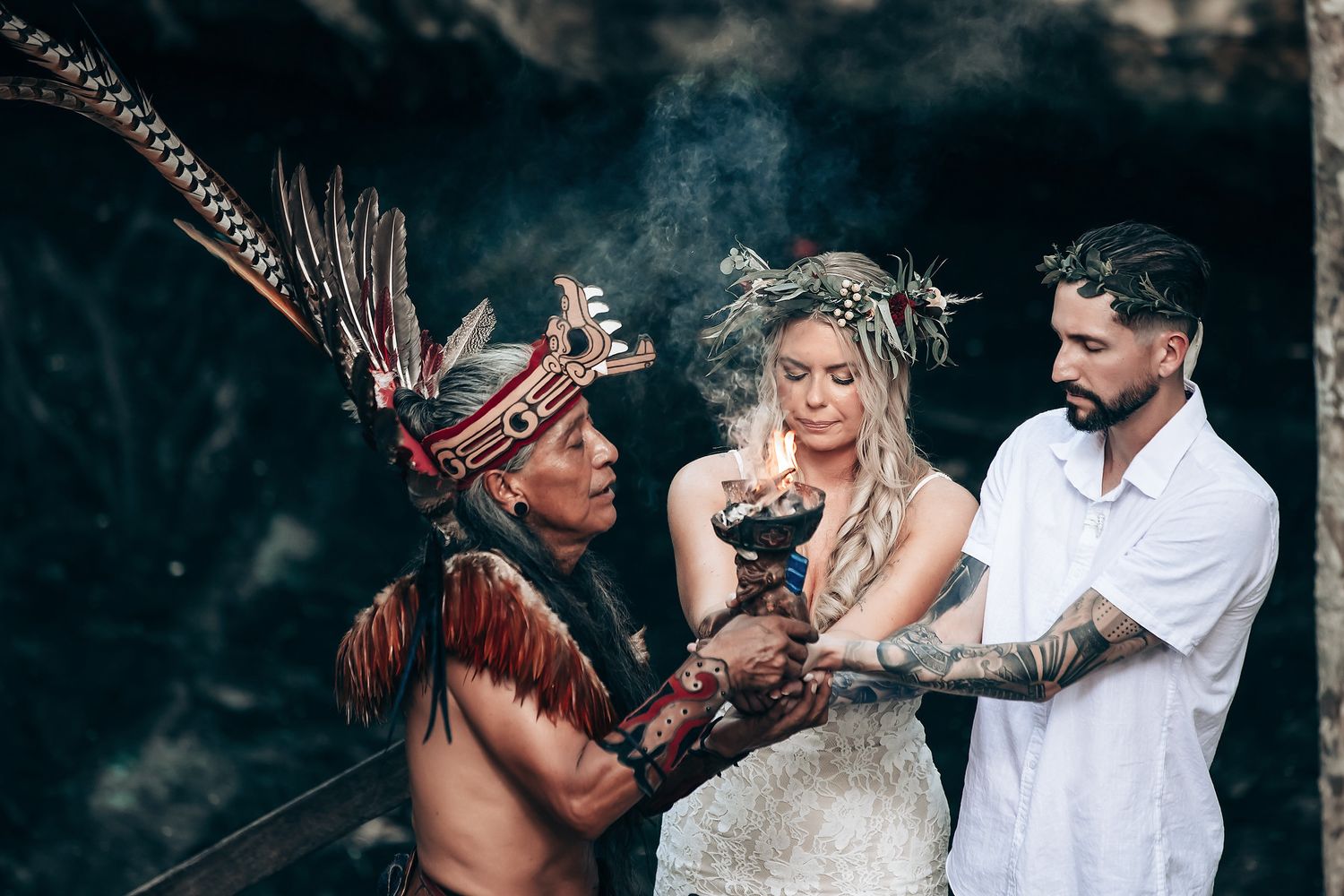Intimate forest ceremony with traditional ceremonial elements and natural lighting.
