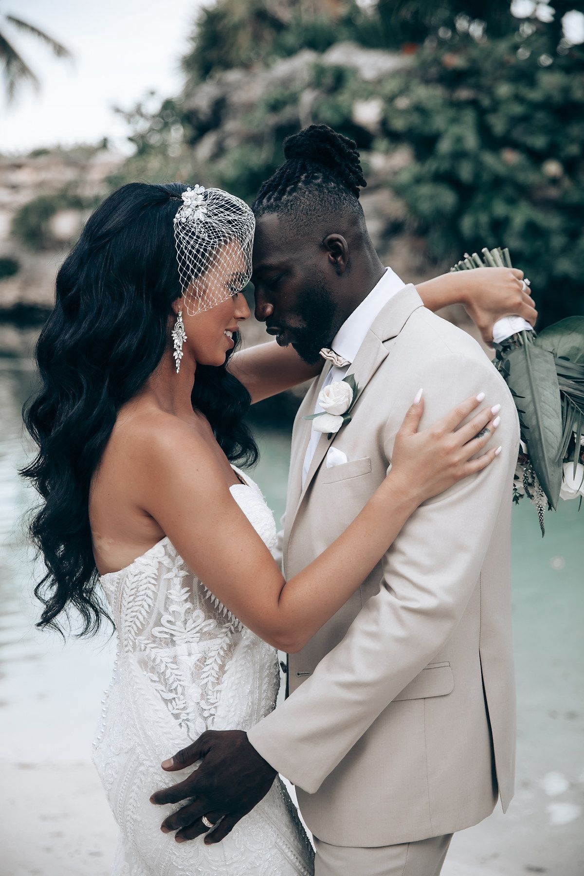 A romantic series of wedding photos showing a couple sharing their first kiss in a dreamy outdoor setting.