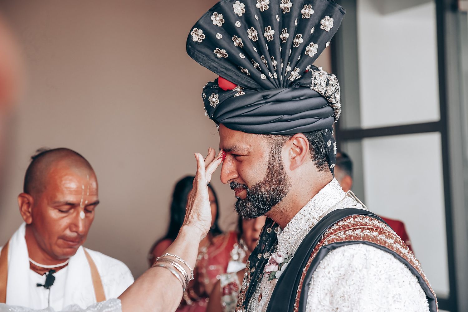 Wedding preparations showing traditional South Asian groom's accessories and turban.