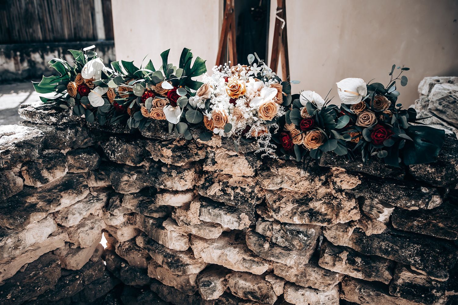 Burned debris and charred remains scattered across a floor in the aftermath of a destructive fire.