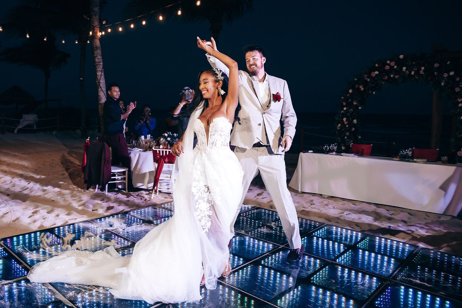 Evening wedding reception with string lights creating a romantic ambiance.