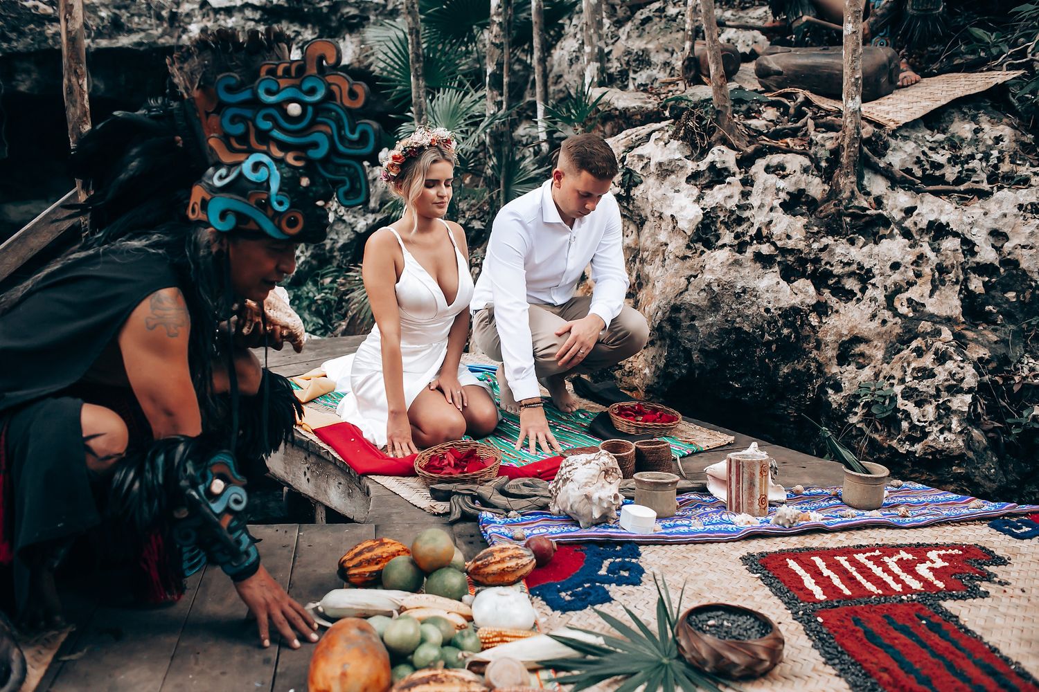Couple enjoying a traditional Balinese purification ceremony at a sacred water temple.