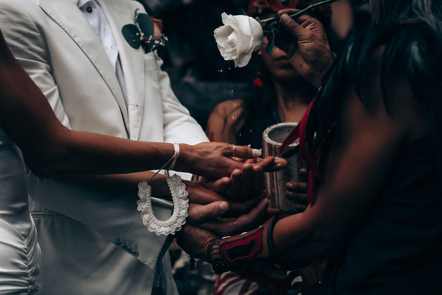 A couple sharing an intimate moment during a wedding celebration.