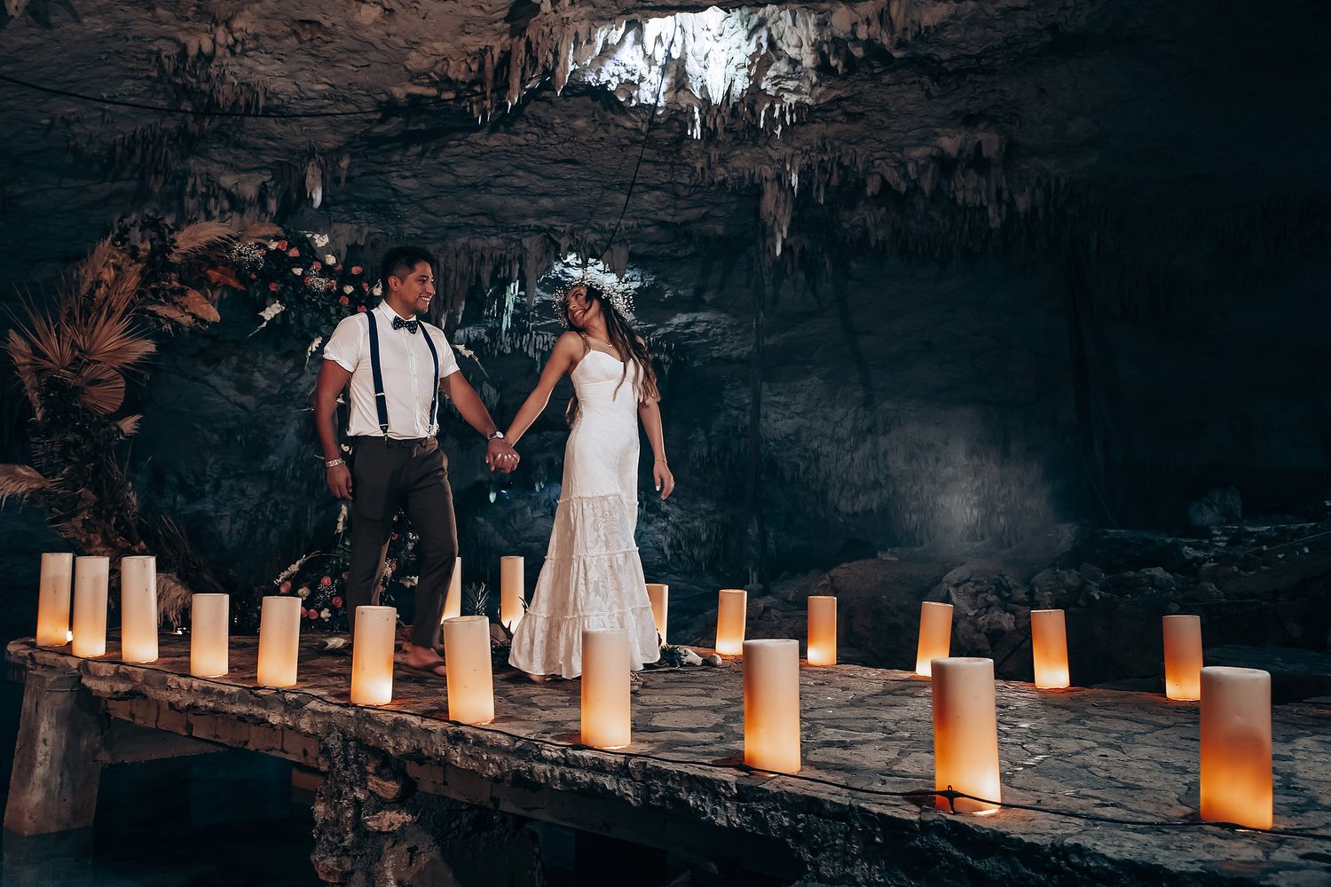 Luminous paper lanterns line a pathway at dusk creating a romantic ambiance for an outdoor evening celebration.