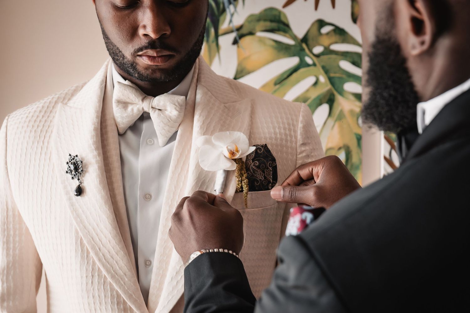 Final wedding preparation moments captured in an elegant indoor setting.