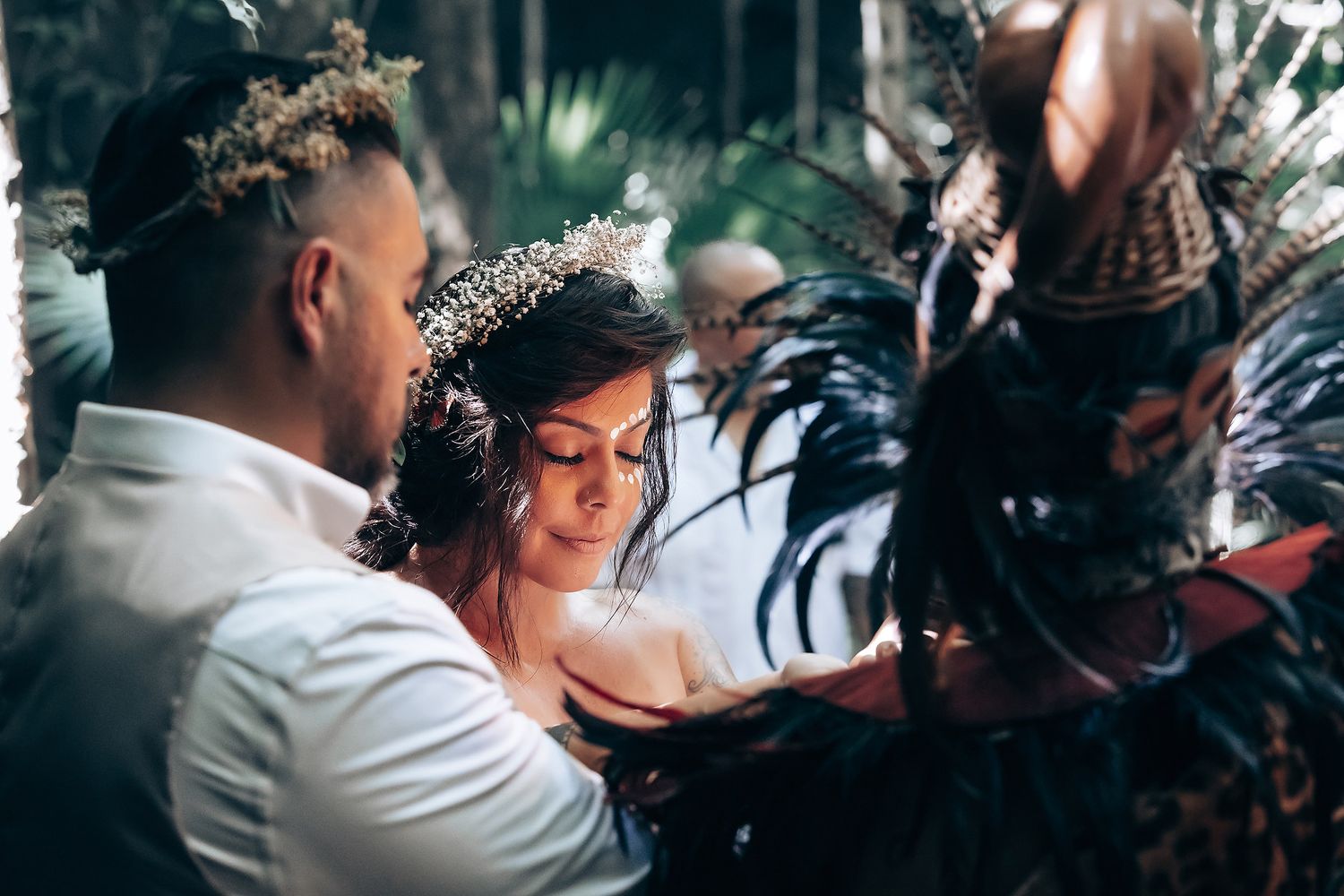 Smoke and sunlight create a mystical atmosphere during a wedding ritual.