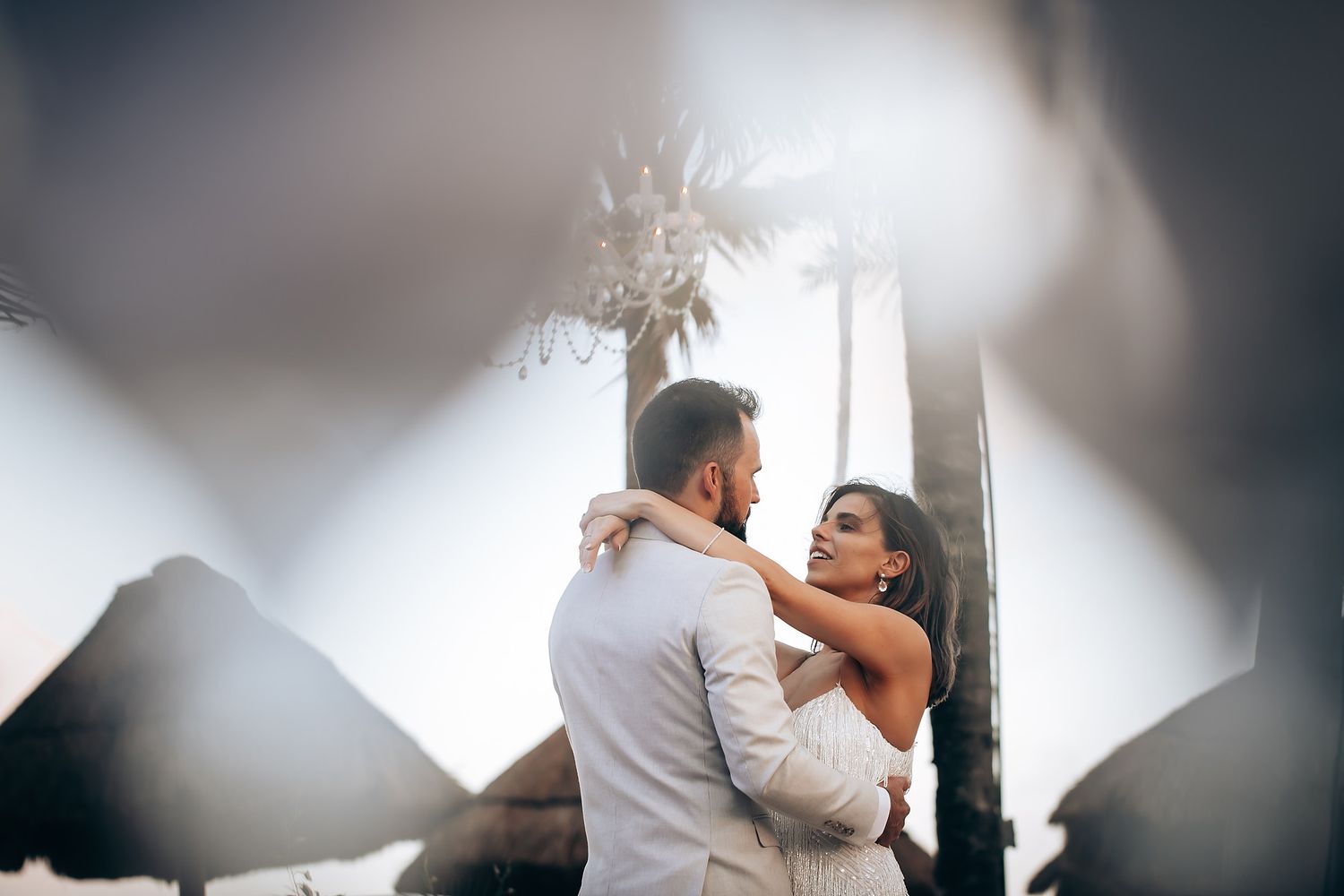 Artistic wedding photography capturing intimate moments through creative angles.