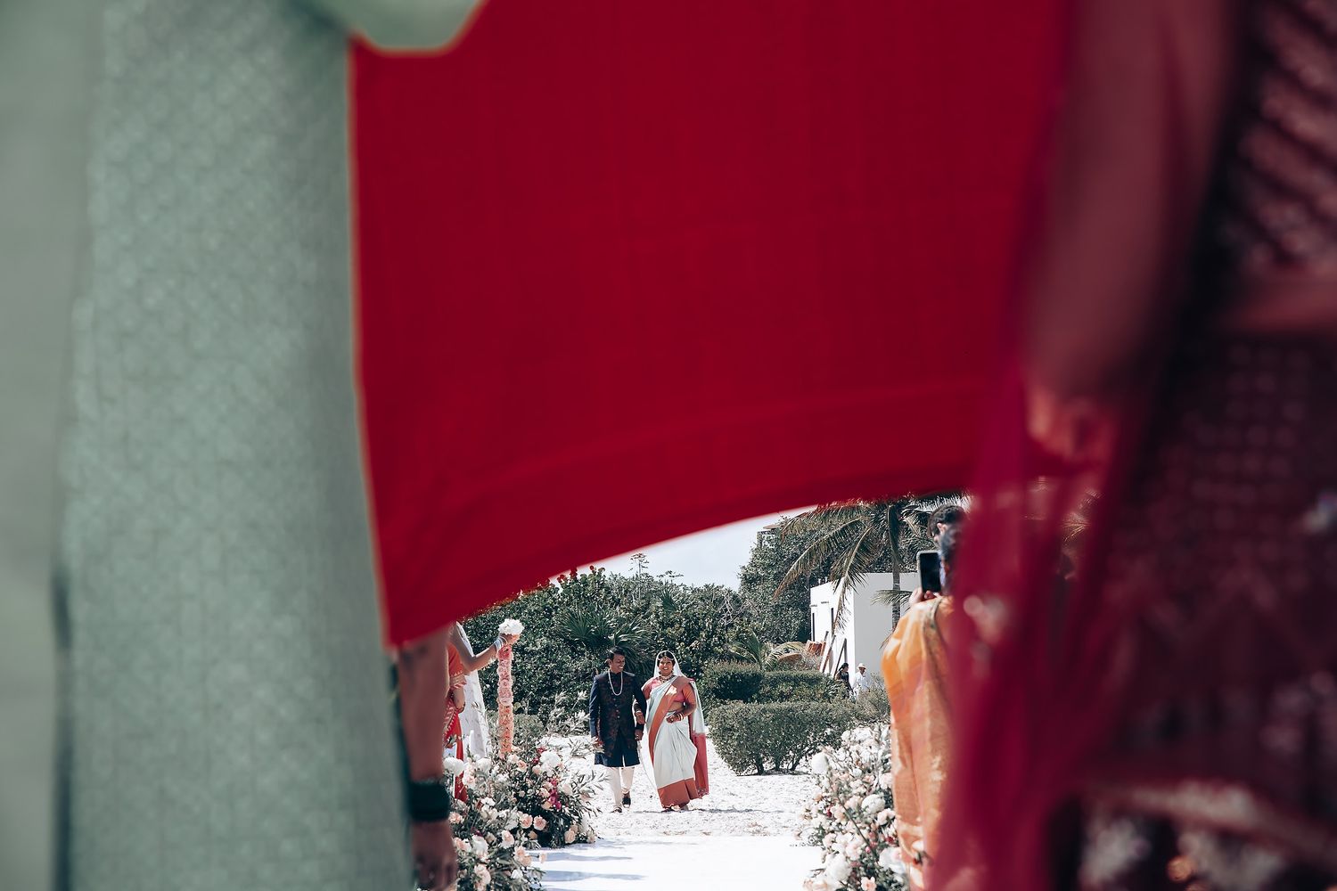 Red and white decorative elements create an elegant wedding ceremony backdrop.