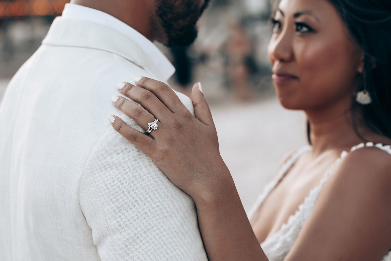 Close-up details of a romantic beach wedding moment.