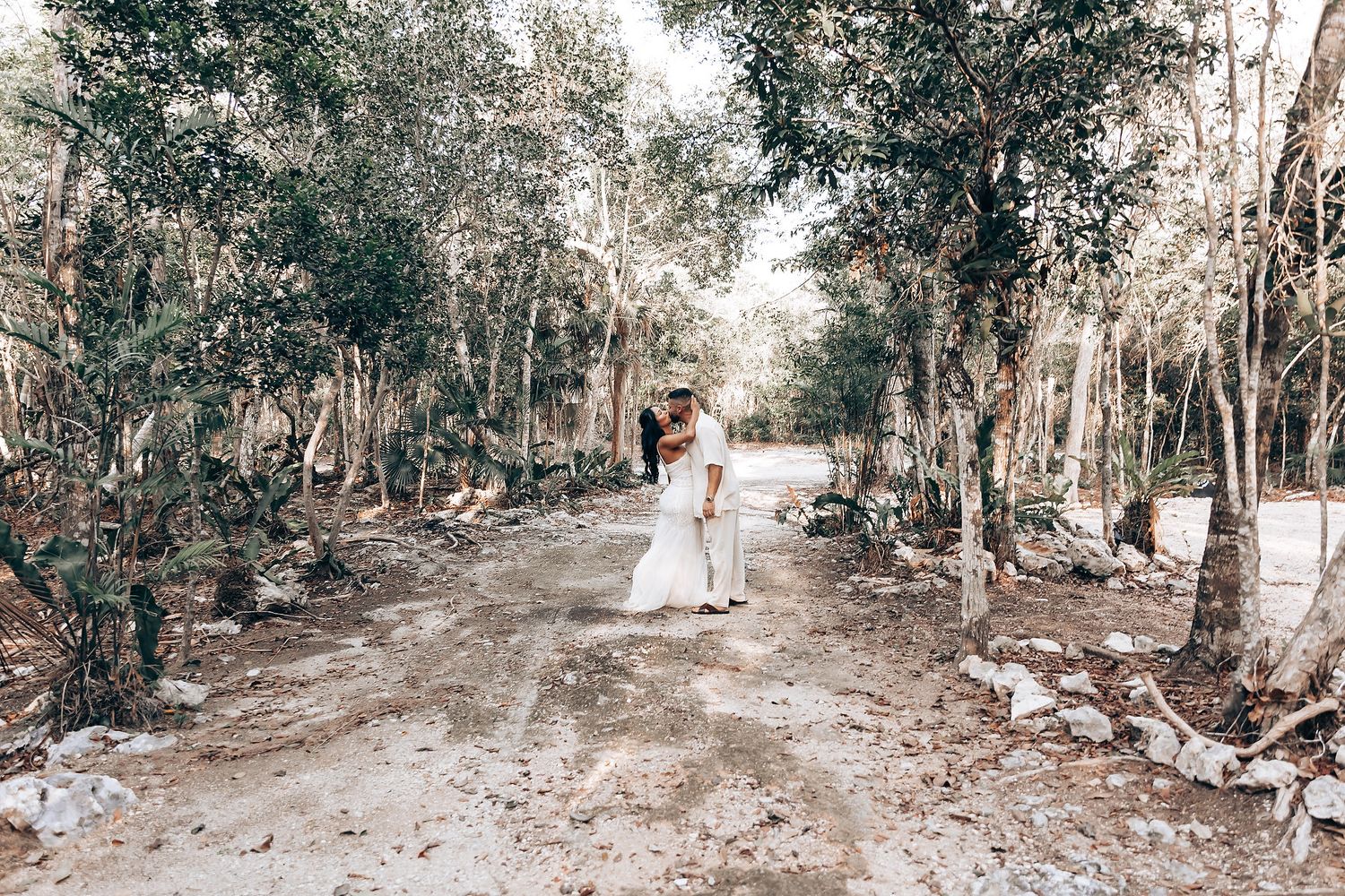 Forest path decorated for a wedding ceremony with natural woodland surroundings.
