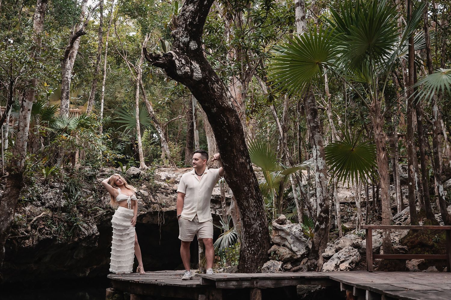 Romantic scene on wooden platform in tropical forest setting.