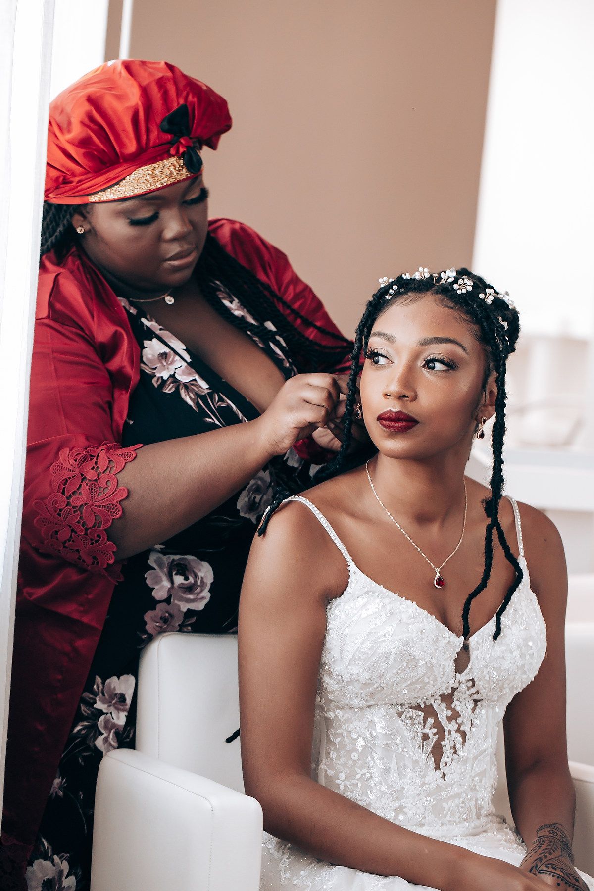 A series of images showing someone getting their hair styled while wearing an elegant white lace wedding dress.