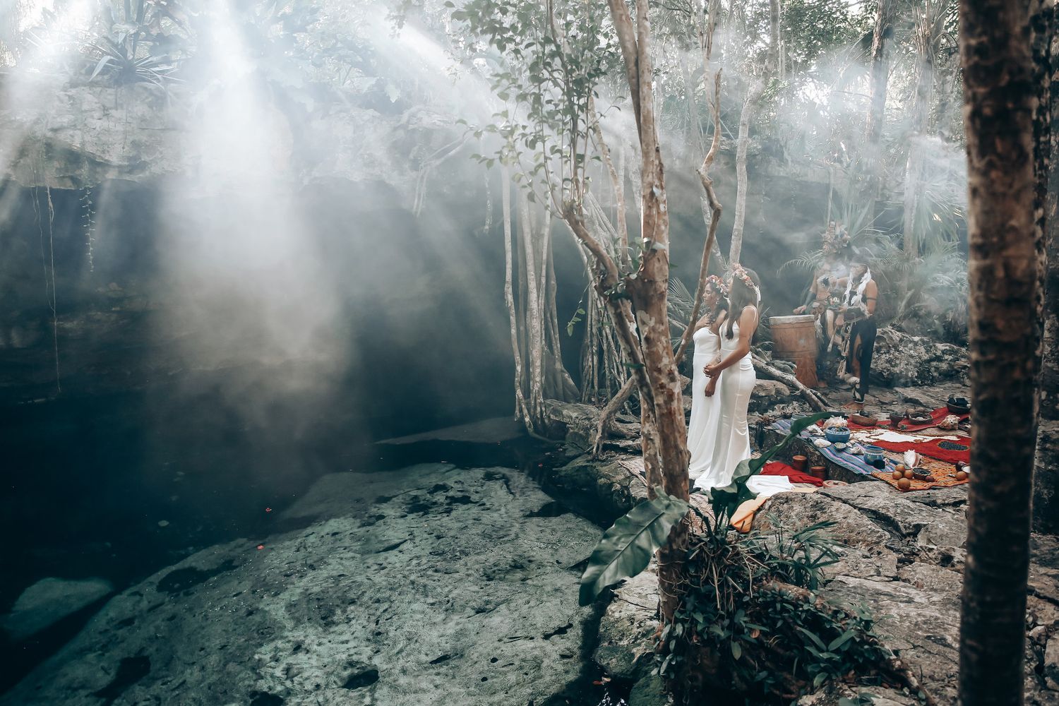 Misty forest landscape with tall trees and filtered sunlight creating an ethereal atmosphere.