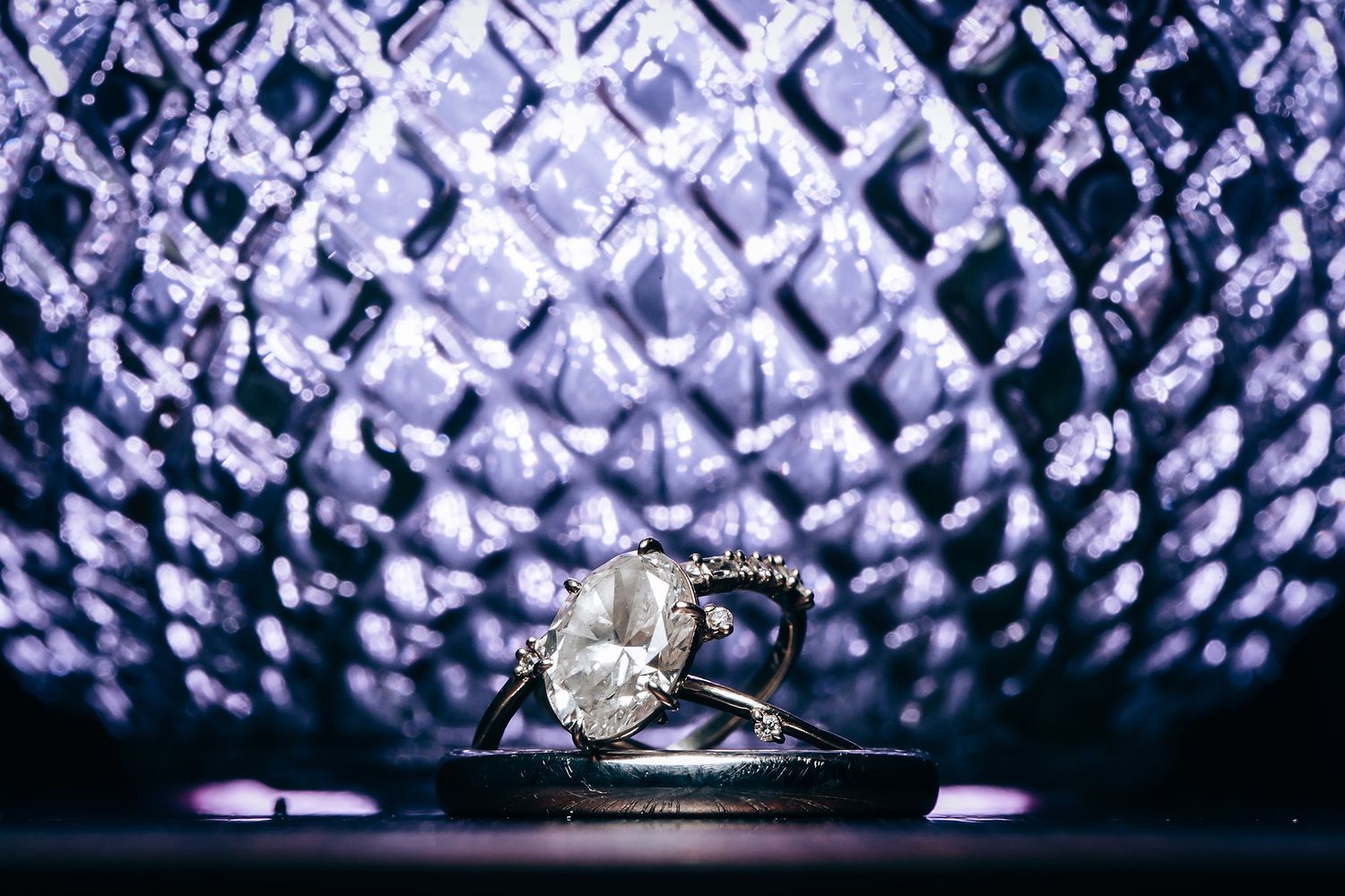 Close-up of sparkling crystal chandelier details creating a luxurious pattern.